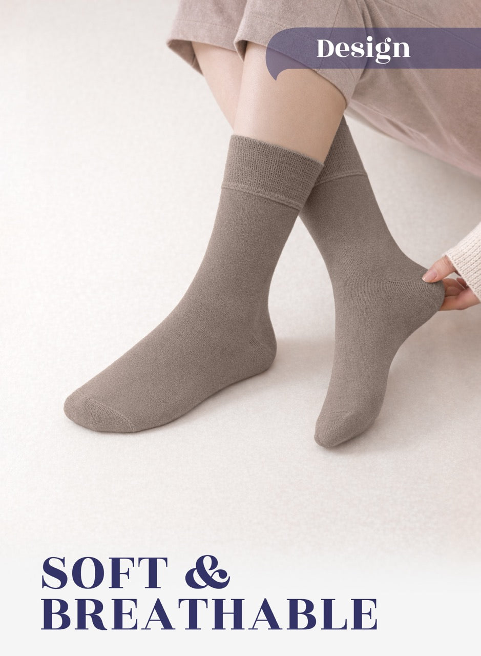 Person wearing dark beige socks on a light background with 'Design' and 'SOFT & BREATHABLE' text.