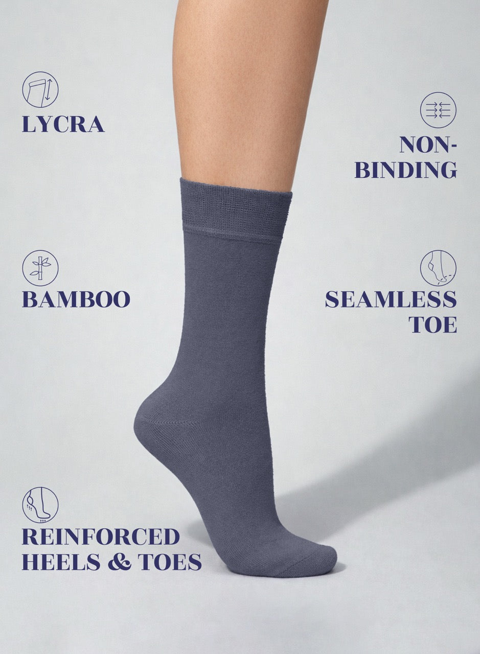 Medium Gray sock on a person's foot with text highlighting features like Lycra, non-binding, bamboo, seamless toe, reinforced heels, and toes.