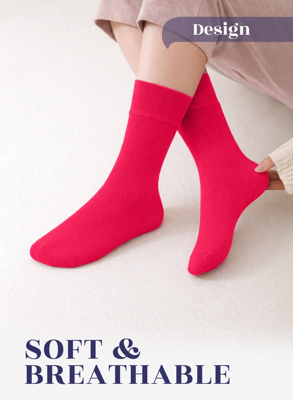 Person wearing bright raspberry red socks on a light background with 'Design' and 'SOFT & BREATHABLE' text.