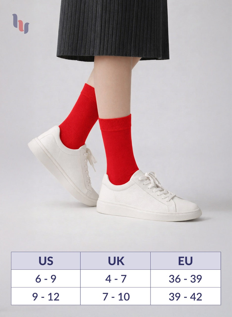 Red socks worn with white sneakers on a light gray background, featuring a size chart.