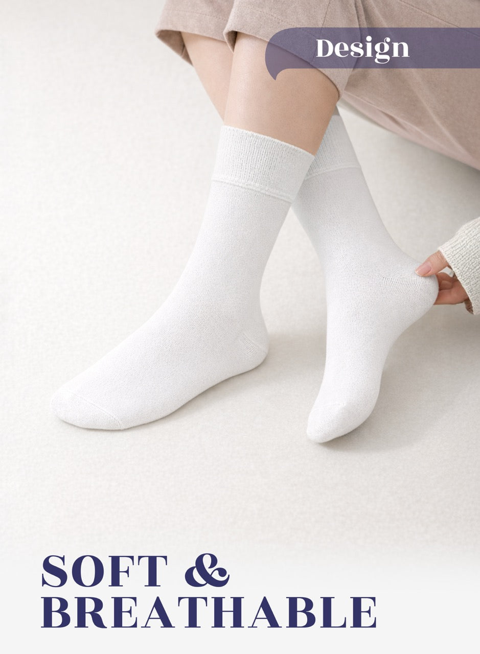 White socks worn by a person on a light background with 'Design' and 'SOFT & BREATHABLE' text.