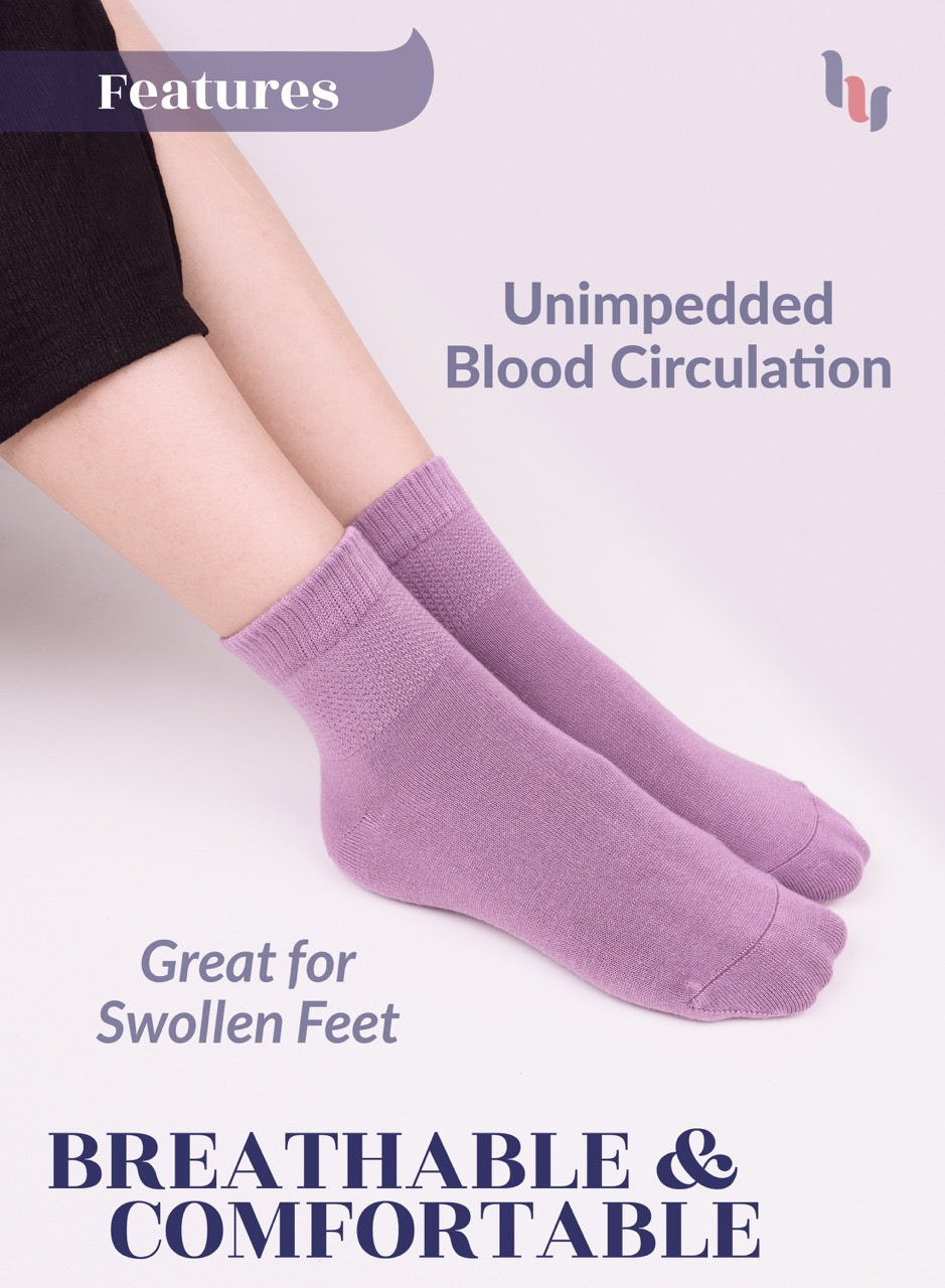 Lilac socks worn by a person with text highlighting features on a light purple background