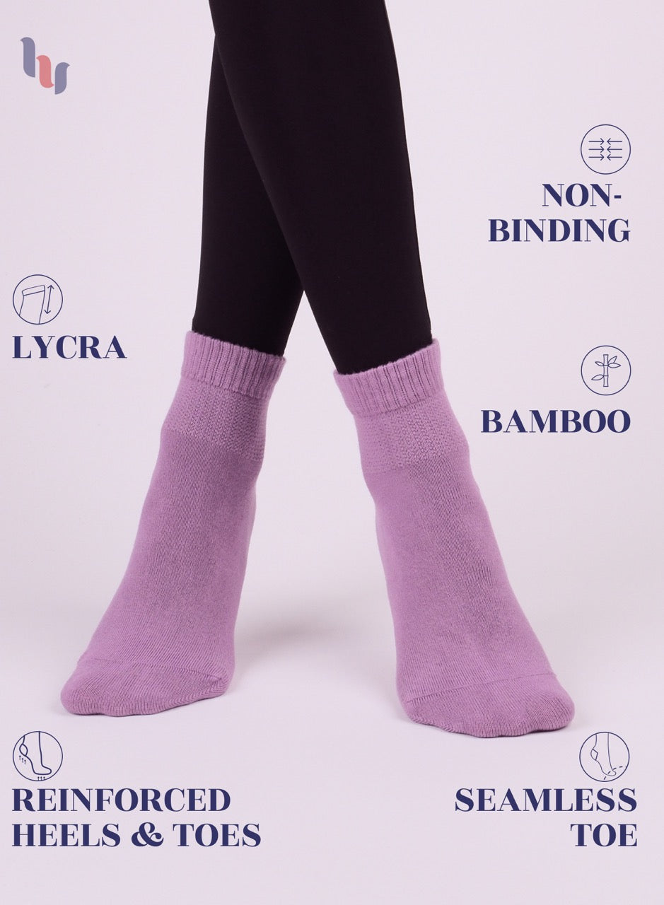 Lilac socks with text highlighting features on a white background