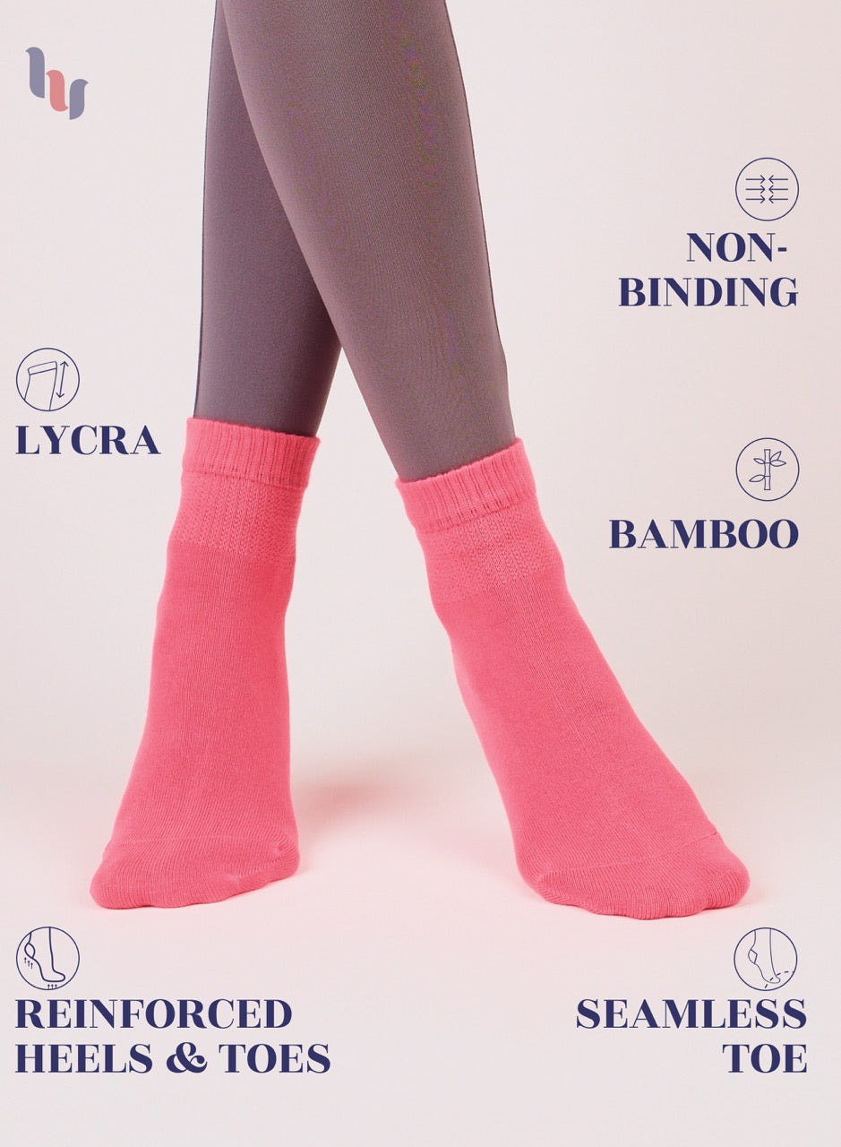 Paradise Pink socks worn with gray leggings on a light background, featuring text about sock features.