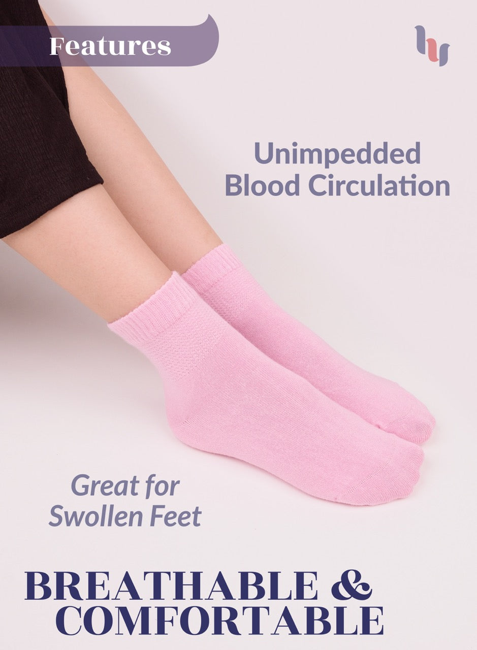 Person wearing pink socks with text highlighting features on a light background