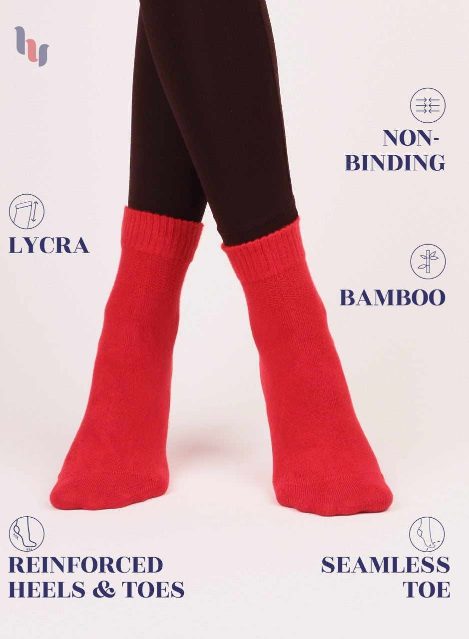 Red socks with text highlighting features on a white background