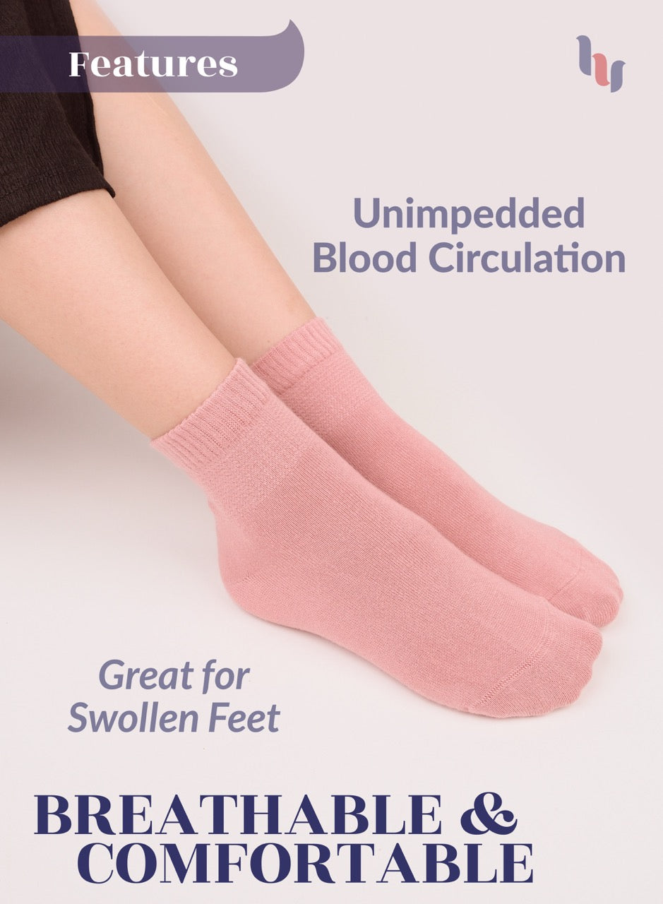 Rose cloud socks worn by a person with text highlighting features on a light background