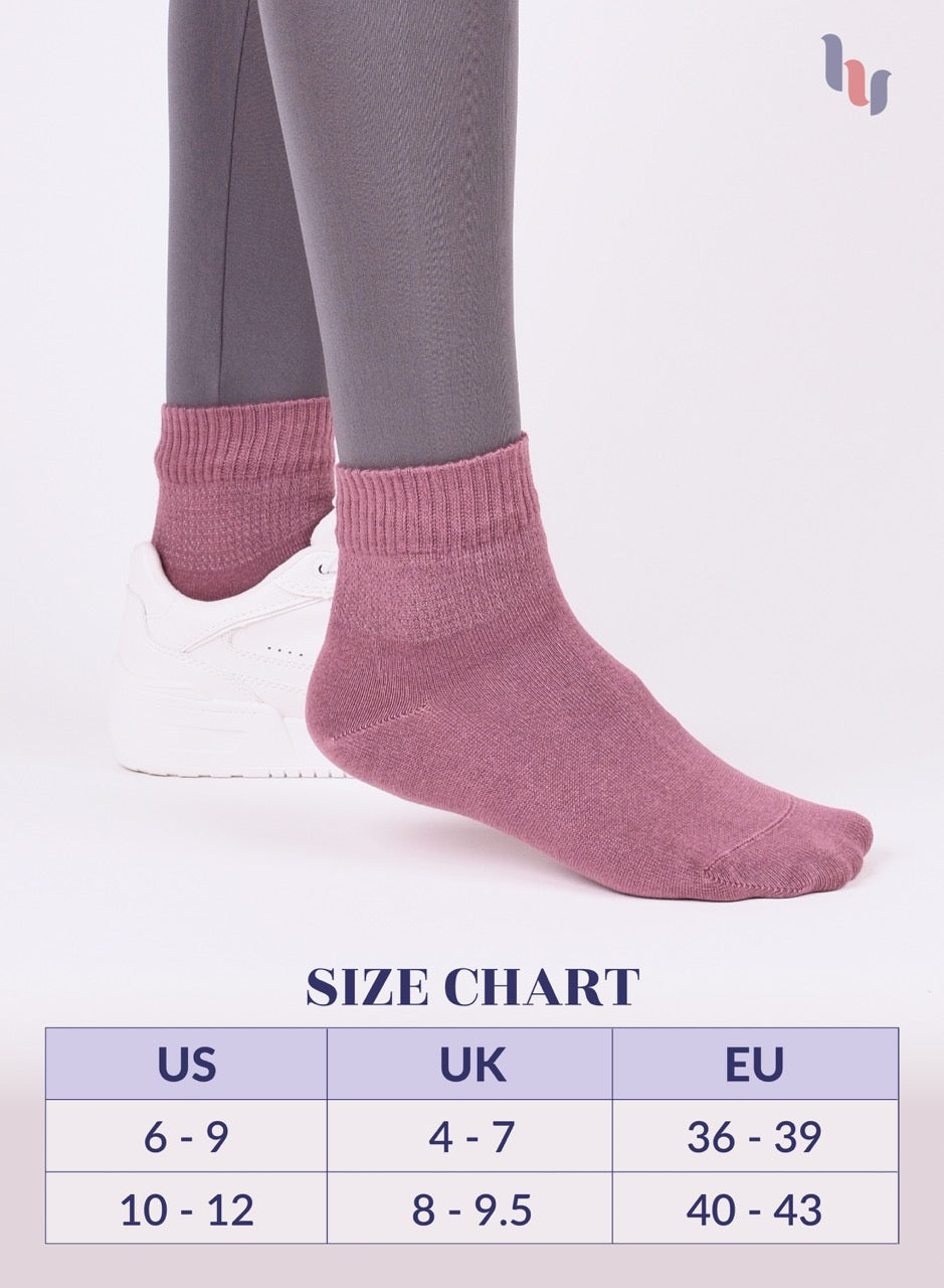 Rose Wood socks being worn with a size chart below on a light gray background