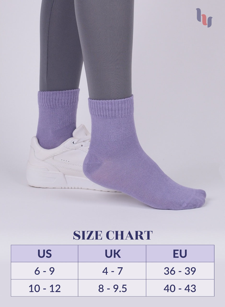 Aster Purple  socks being worn with a size chart below on a light gray background