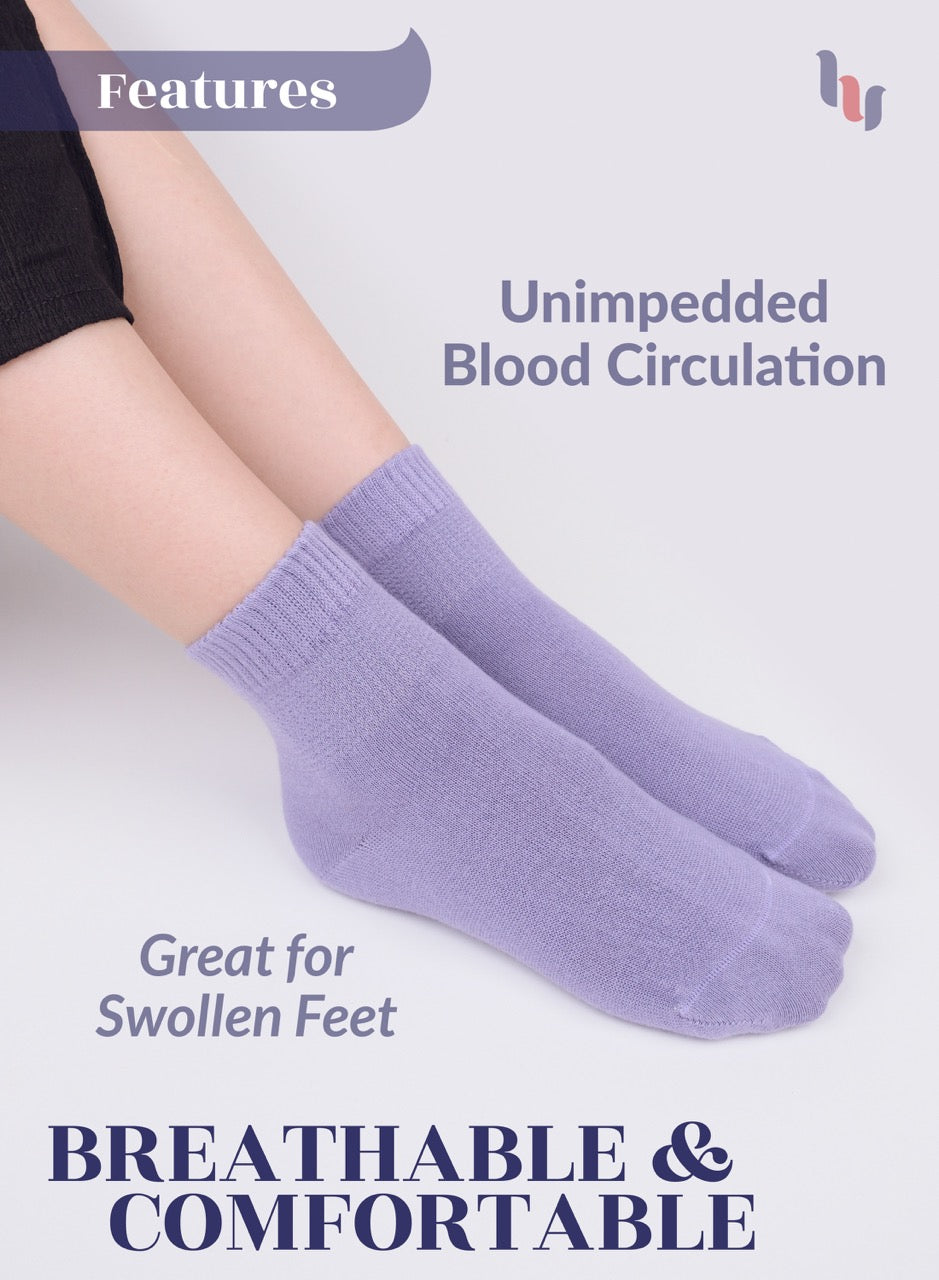 Aster Purple socks worn by a person with text highlighting features on a light background