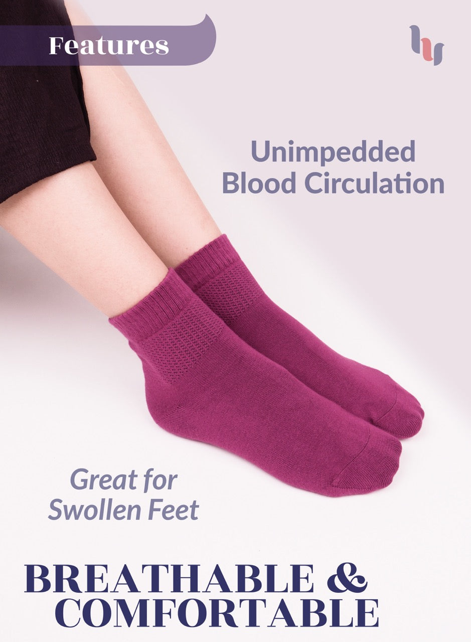 Fuchsia socks worn by a person with text highlighting features on a light background