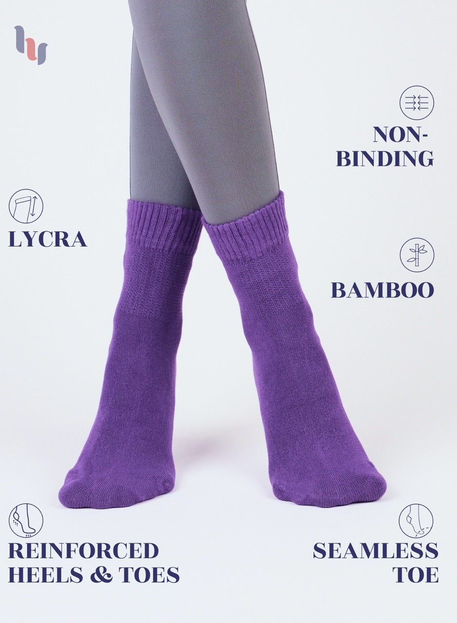 Purple socks worn with gray tights on a white background, featuring text about sock features.