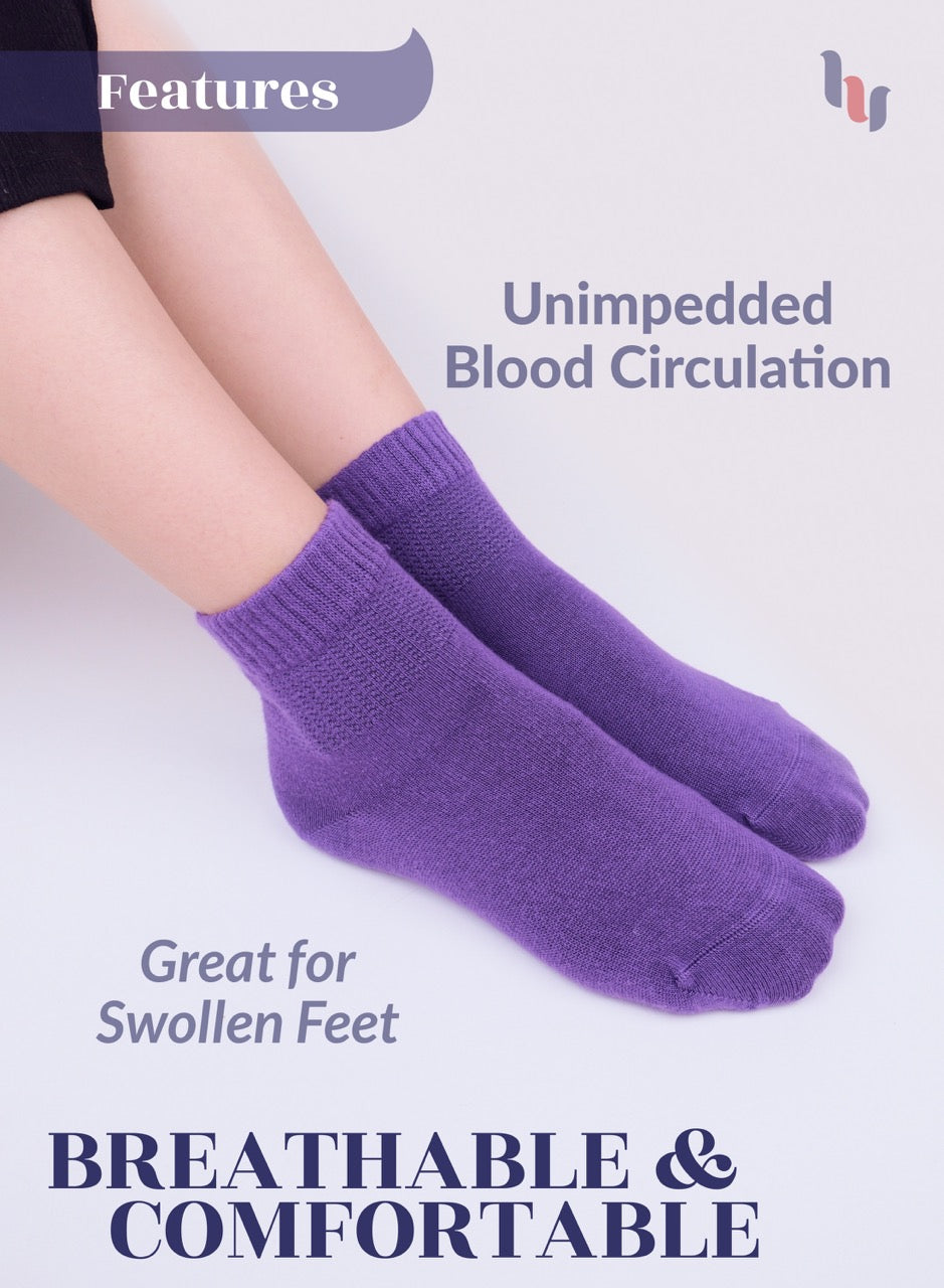 Purple socks worn by a person with text highlighting features on a light gray background