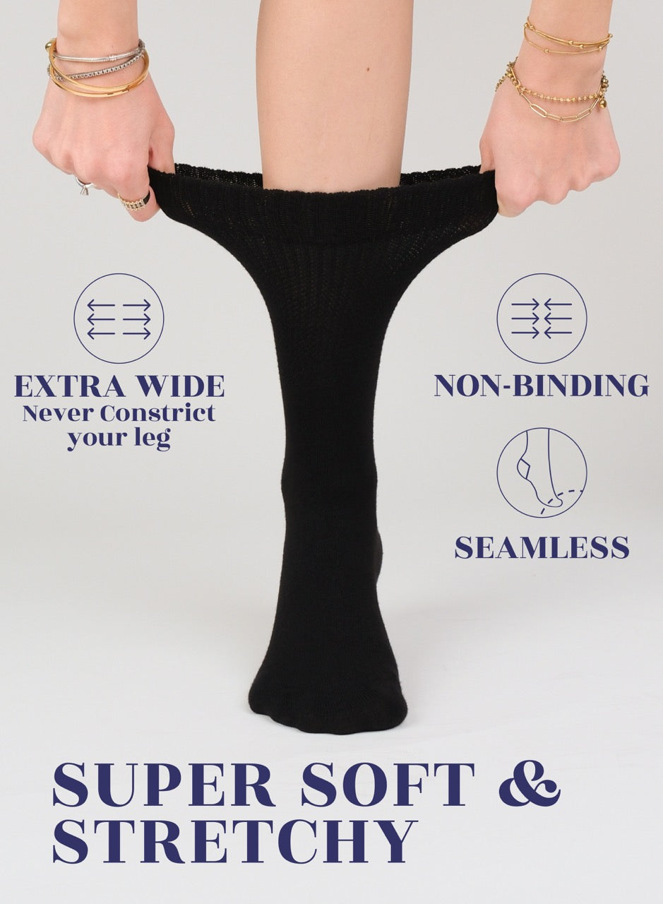 Black sock being held up with text describing features on a light gray background