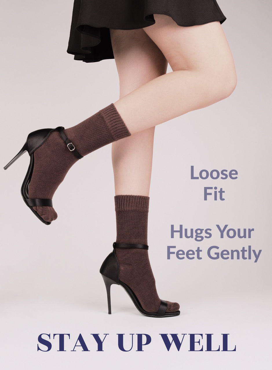Brown high-heeled shoes with matching socks on a plain background, featuring text about shoe fit.