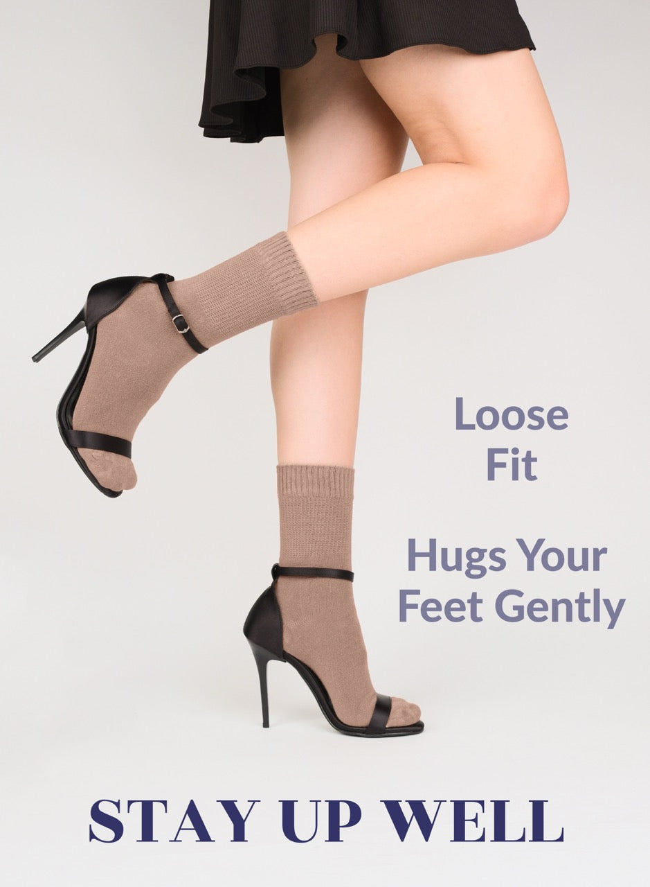 Legs wearing high-heeled shoes and Milk Coffee crew socks with text on a light gray background