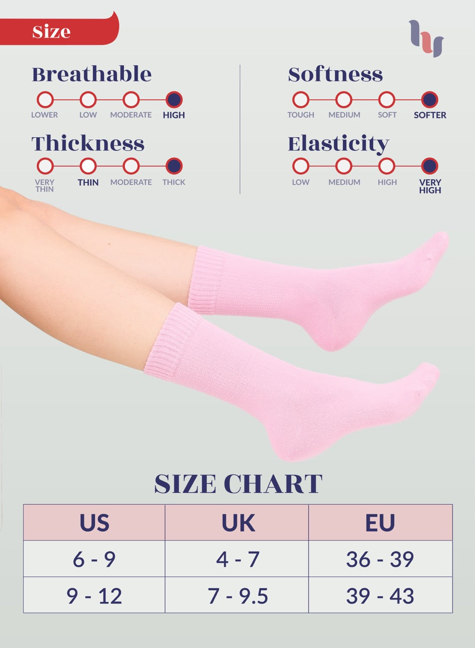 Pink crew socks with size chart and on a light gray background