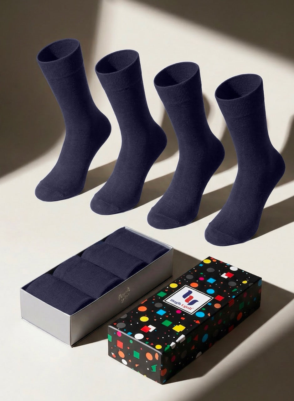Four navy blue socks with a branded box on a light background