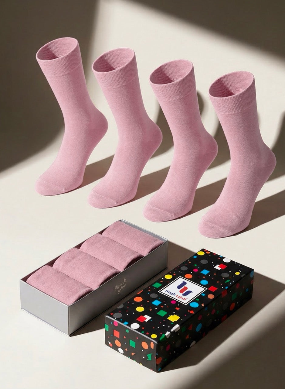 Set of rose cloud socks with a patterned box on a light background