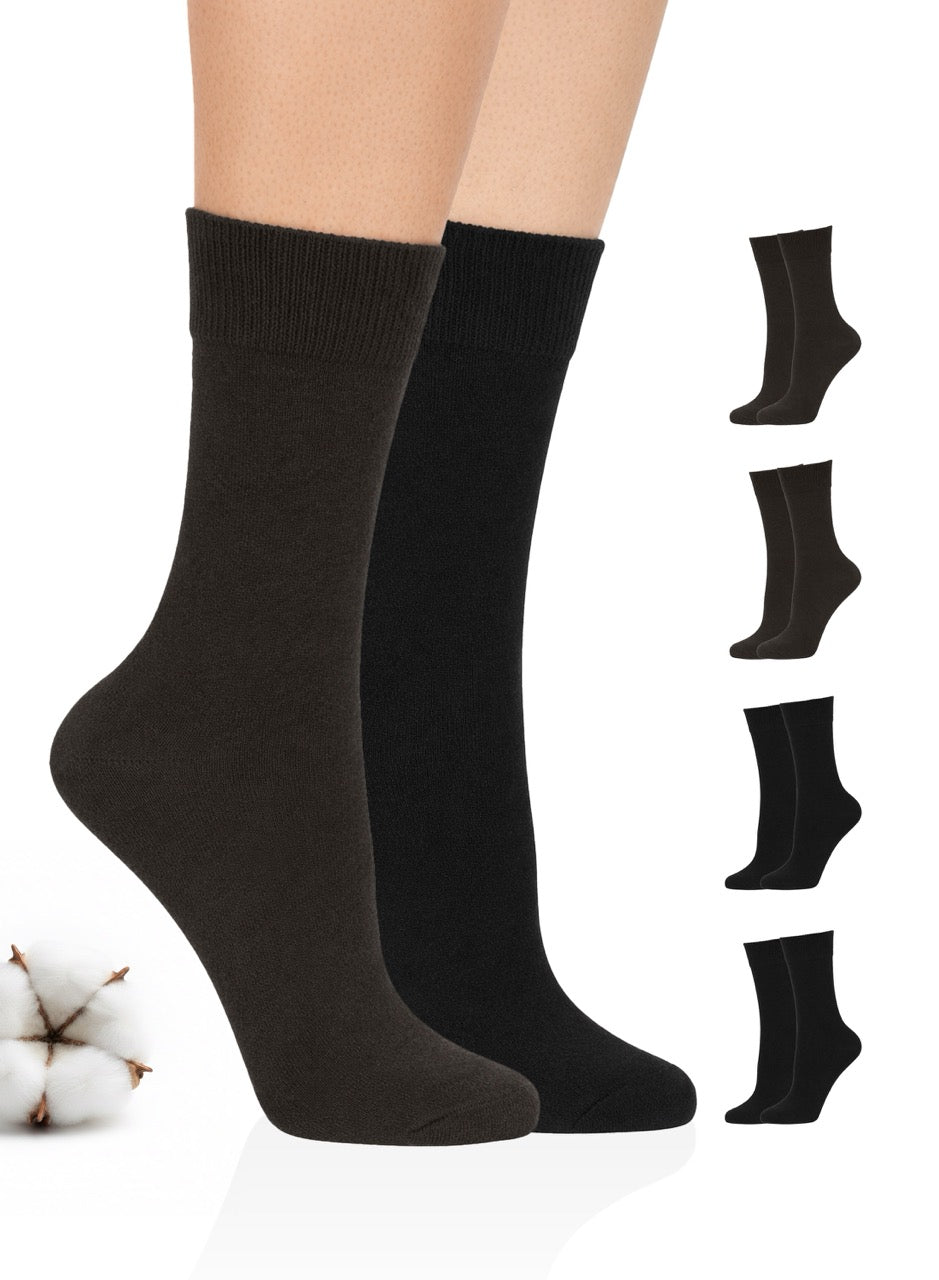 Black and dark brown socks displayed on a person's legs with additional pairs shown below on a white background.