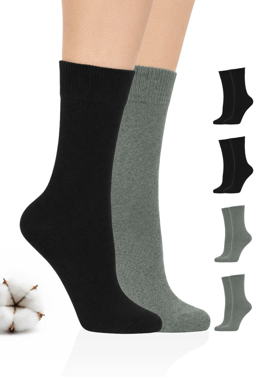 Black and gray socks displayed on a white background with cotton visible.