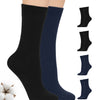 Black and navy blue socks on a white background with cotton and additional pairs displayed.