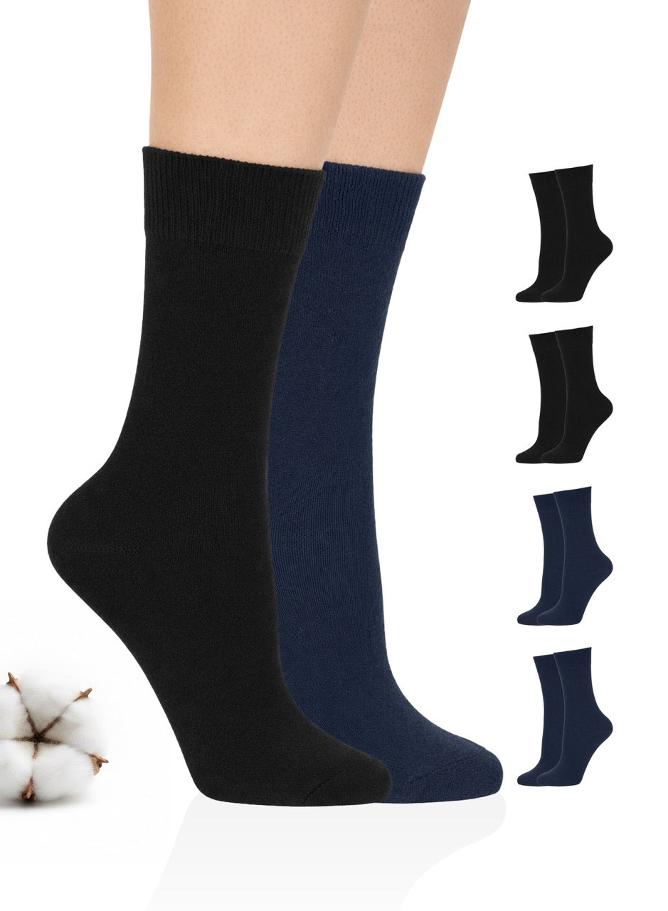 Black and navy blue socks on a white background with cotton and additional pairs displayed.