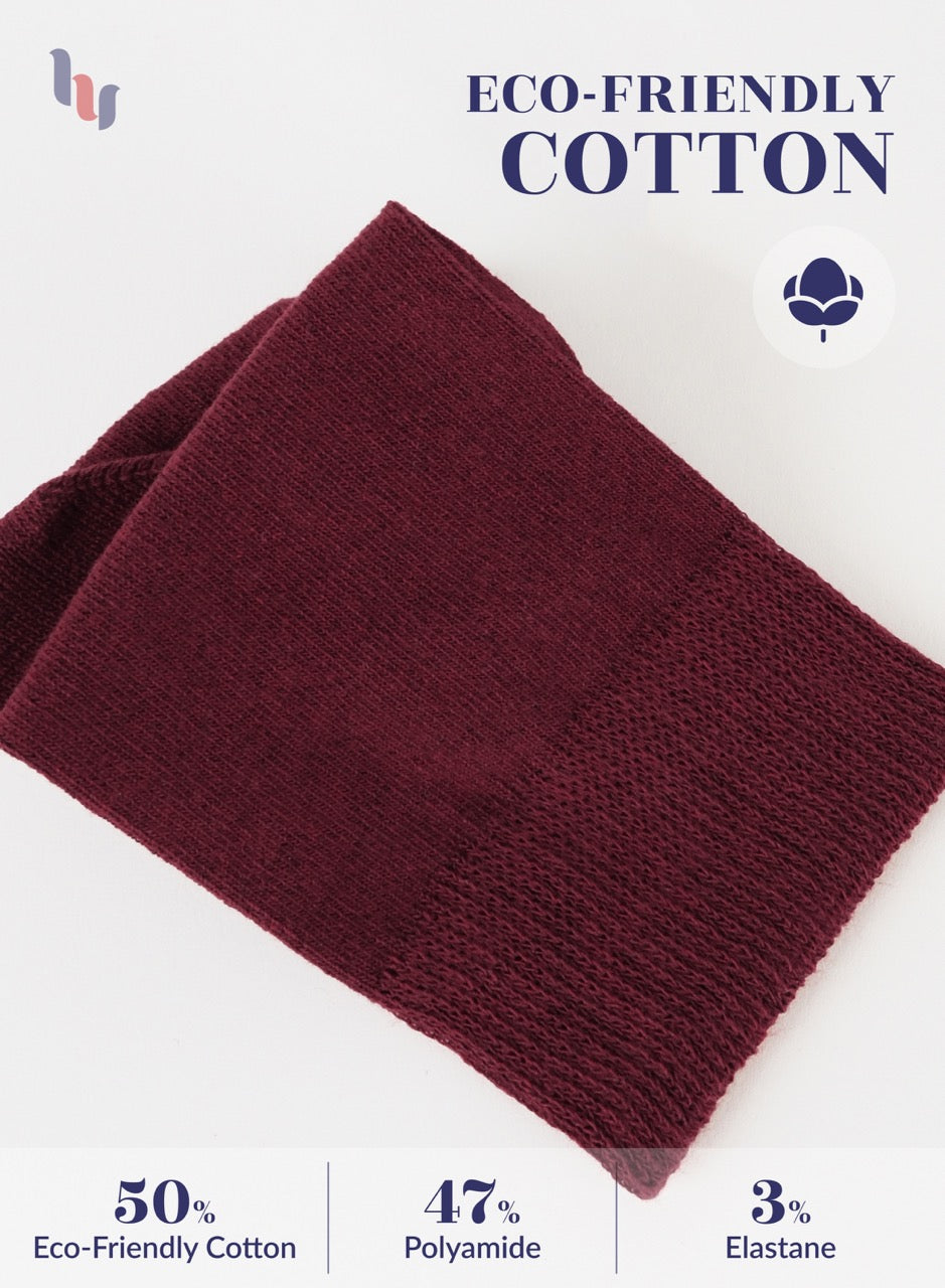 Burgundy knitted socks with eco-friendly cotton label on a white background