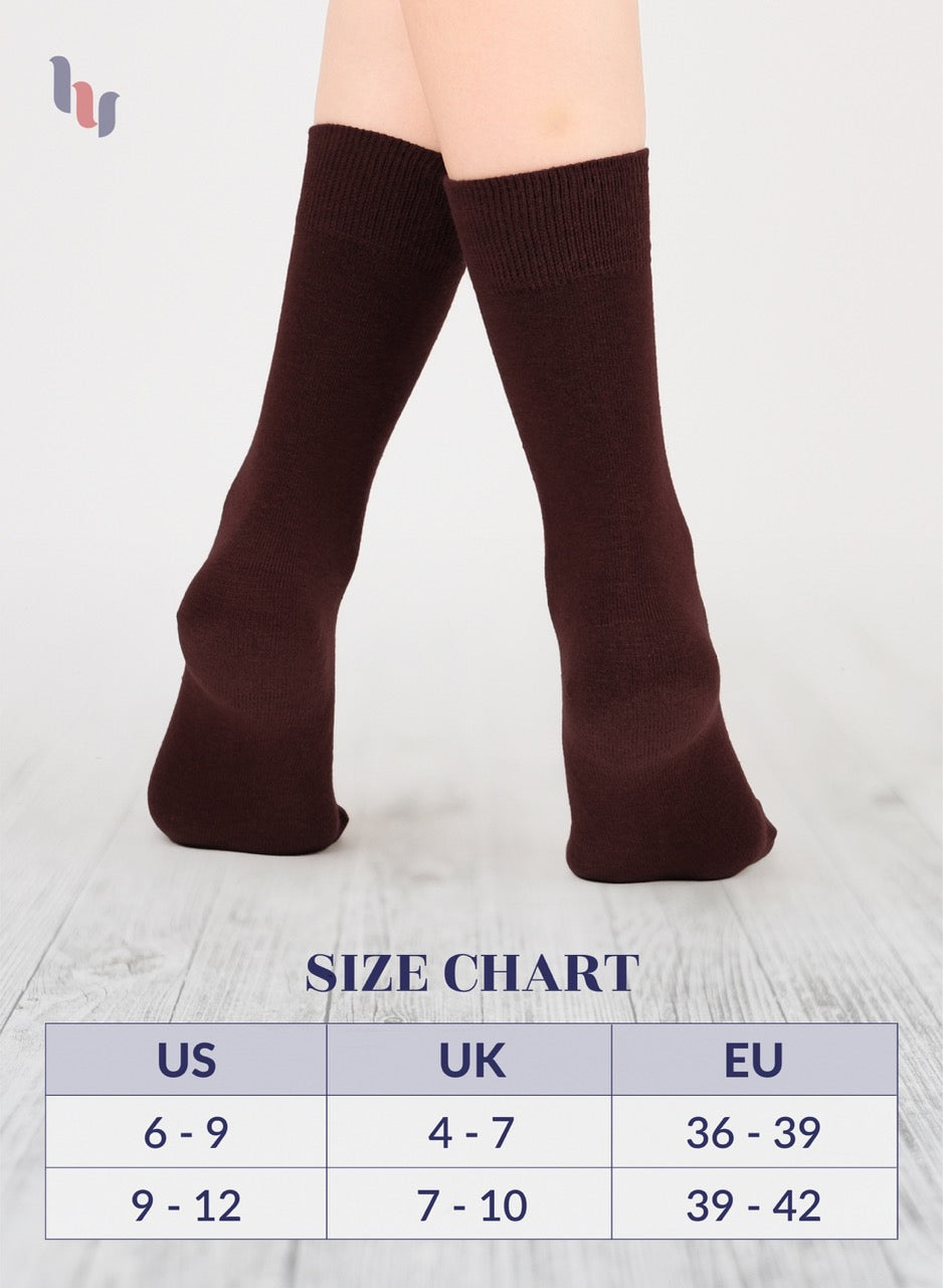 Dark Brown crew socks worn by a person on a light gray background with a size chart below.