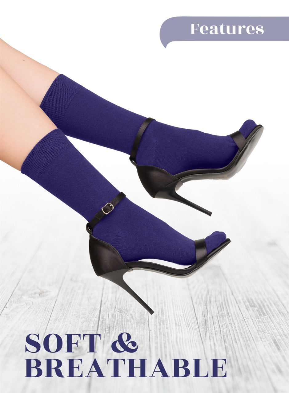 Purple socks with high-heeled shoes with open toes on a light wooden floor, labeled 'Soft & Breathable'.
