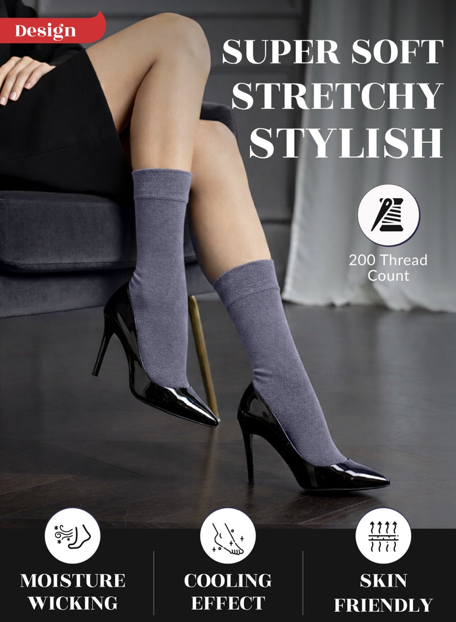 Woman wearing gray crew socks with text highlighting features on a dark background