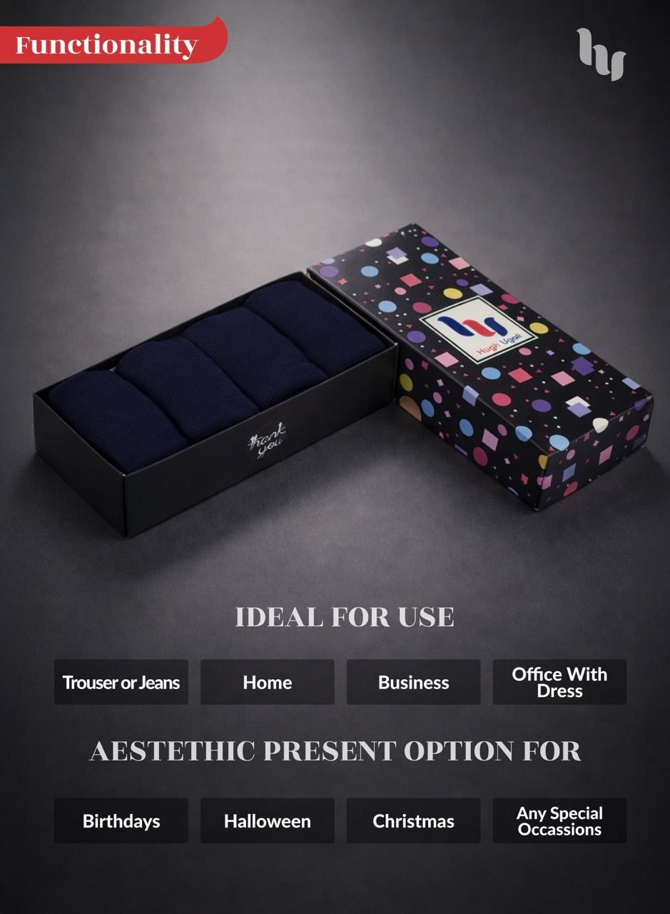 Set of navy blue socks in a patterned box on a dark background