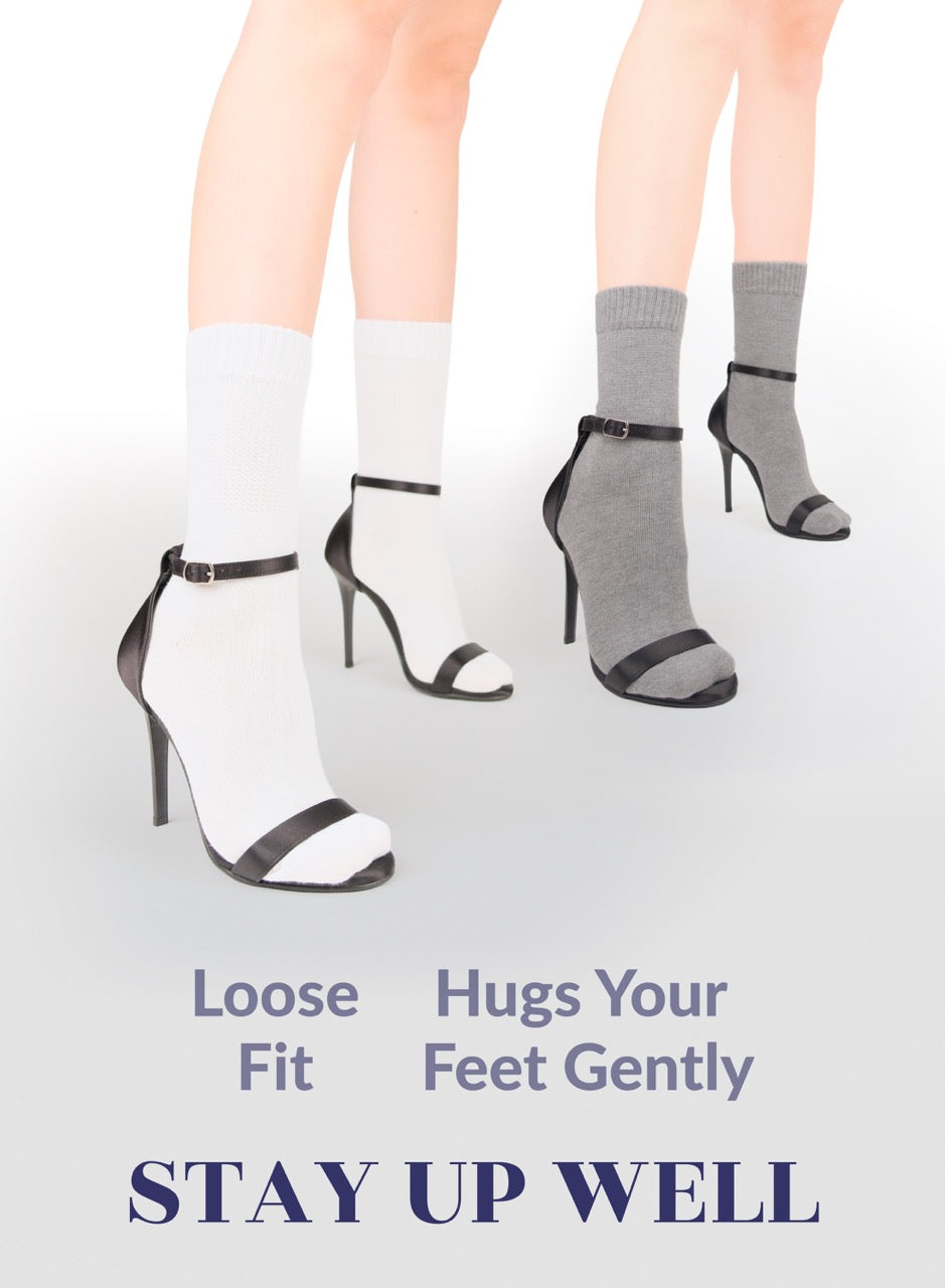 Gray crew socks with high-heeled shoes on a white background, featuring text about sock fit.