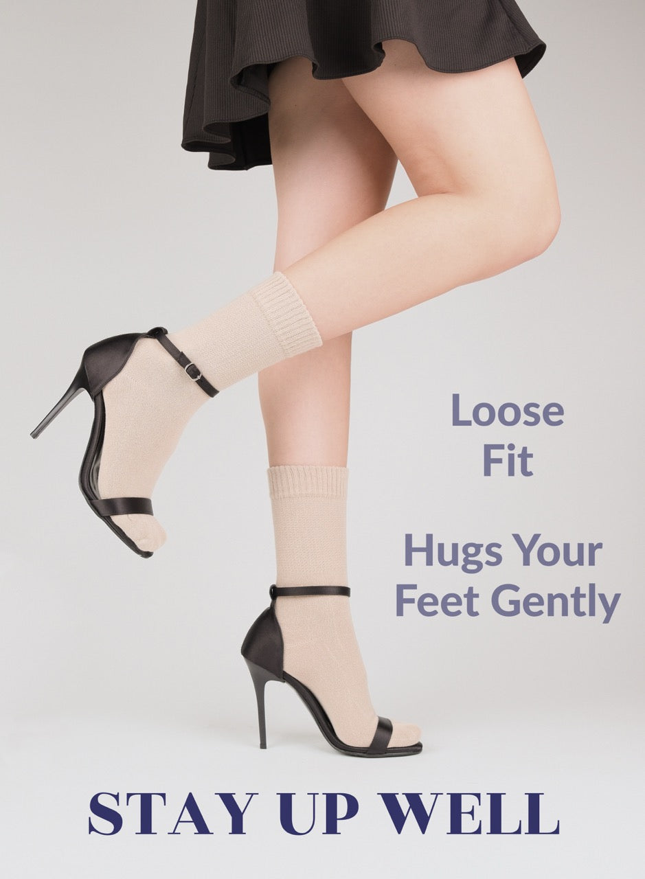 Person wearing high-heeled shoes with text about light beige sock fit on a light gray background