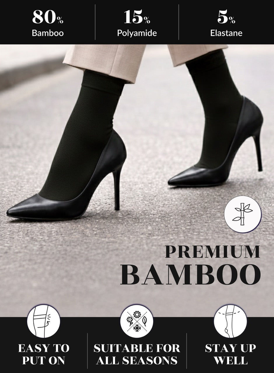 Black high-heeled shoes worn with a person's legs, featuring bamboo sock technology and product benefits.