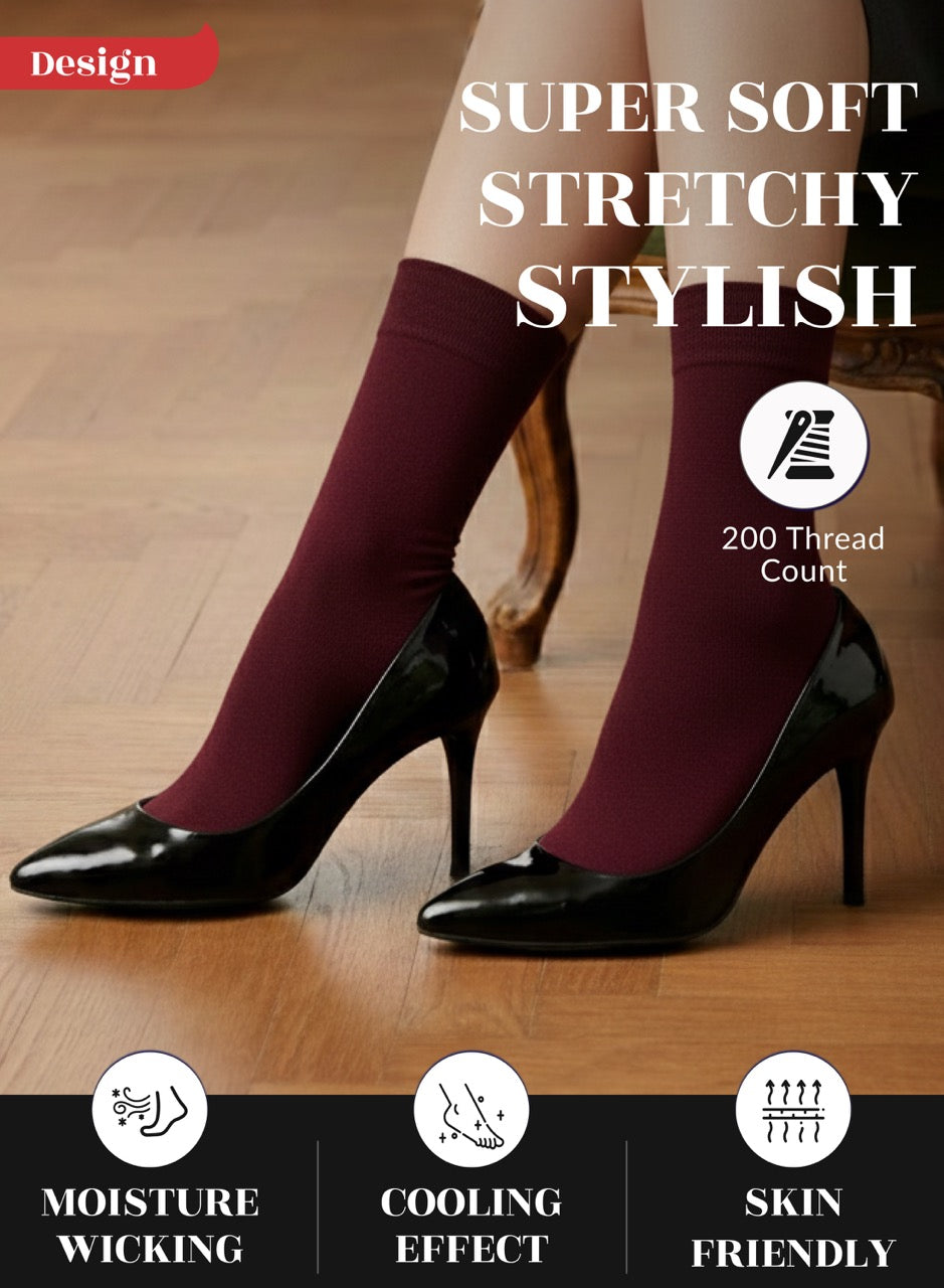 Burgundy socks with black high heels on a wooden floor, featuring text about sock properties.