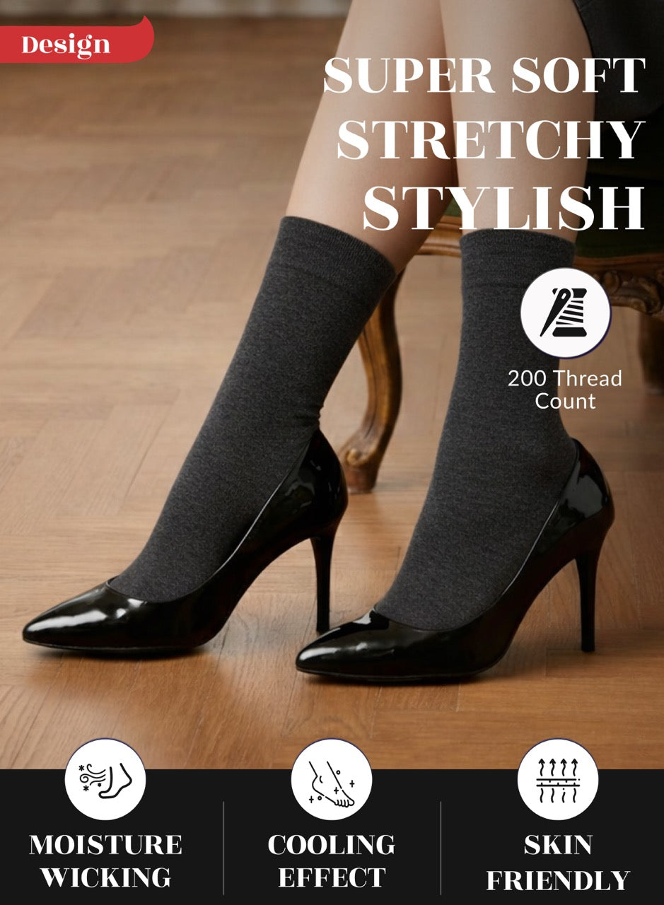 Charcoal grey socks worn with black high heels on a wooden floor, highlighting features like 'Super Soft', 'Stretchy', 'Stylish', 'Moisture Wicking', 'Cooling Effect', and 'Skin Friendly'.