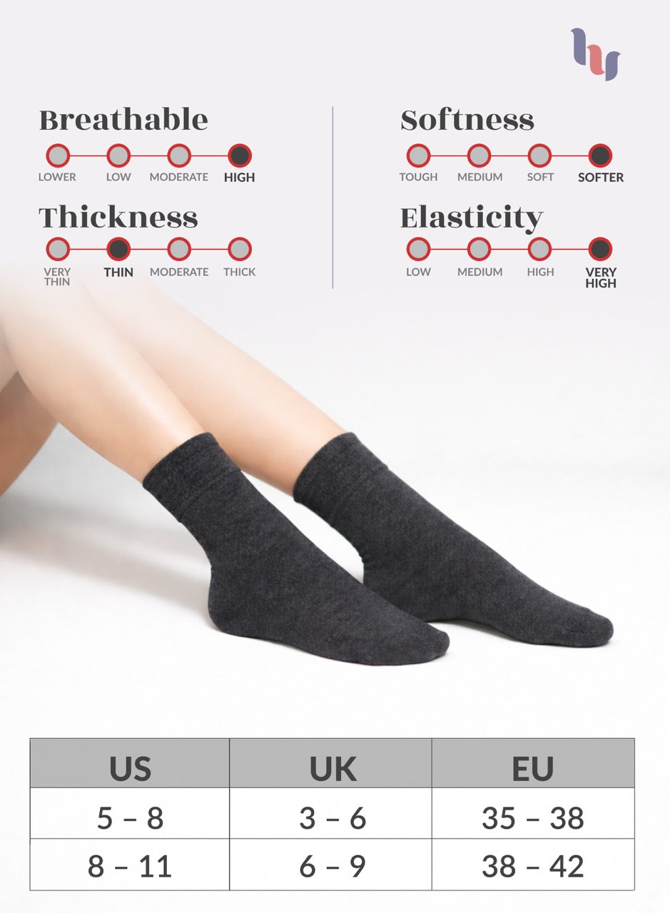 Charcoal grey socks with size chart and property ratings on a light gray background