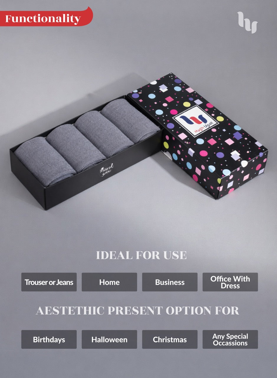 Gray socks in a black box with a colorful polka dot pattern on a gray background