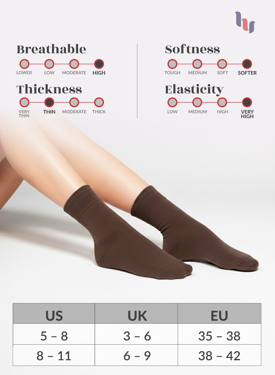 Light brown socks worn by a person with measurement chart below on a light gray background
