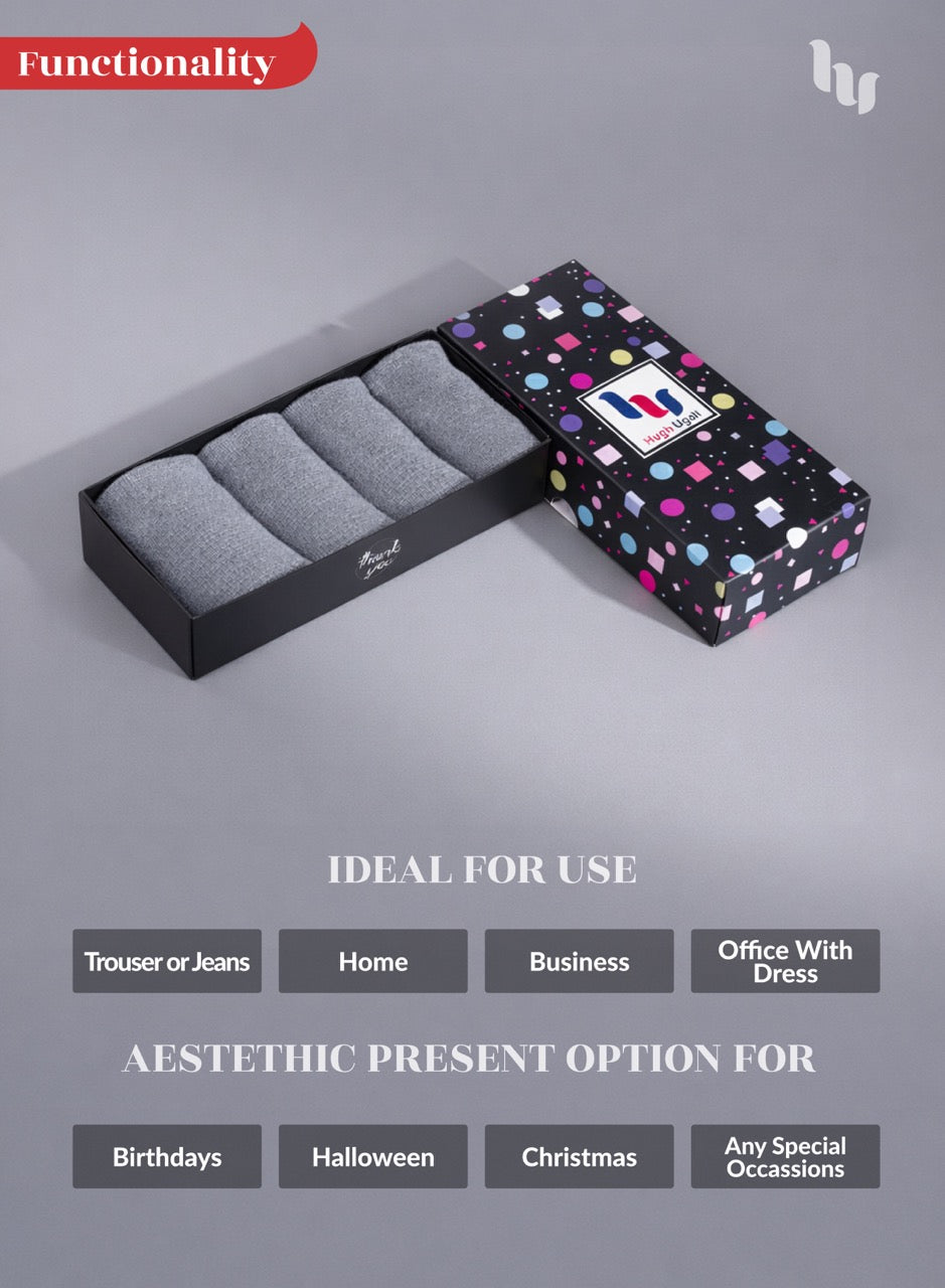 Light grey socks in a black box with a colorful patterned box on a gray background