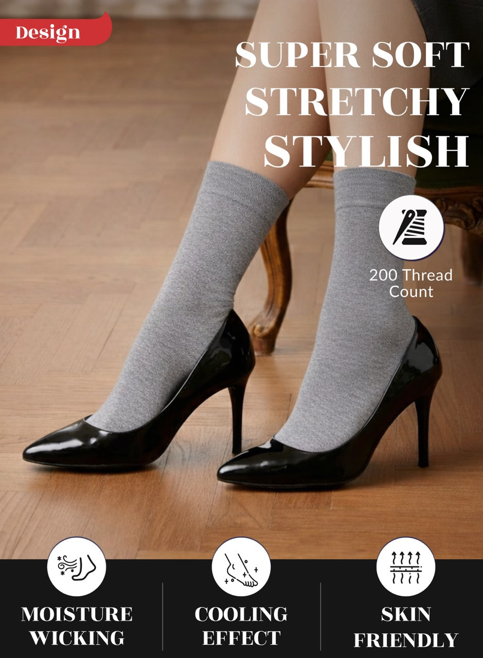 Light grey socks worn with black high heels on a wooden floor, highlighting features like 'Super Soft', 'Stretchy', 'Stylish', 'Moisture Wicking', 'Cooling Effect', and 'Skin Friendly'.