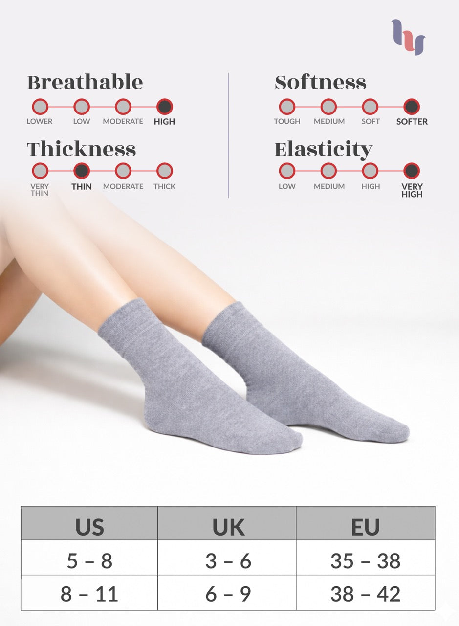 Light grey socks with measurement chart on a light gray background