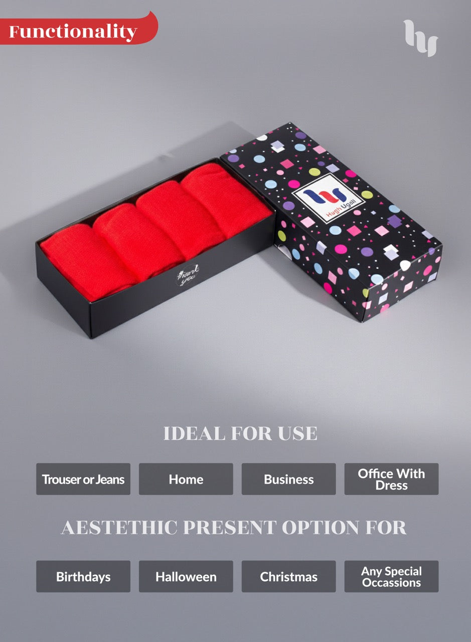 Red boxer briefs in a black box with a colorful patterned lid on a gray background.