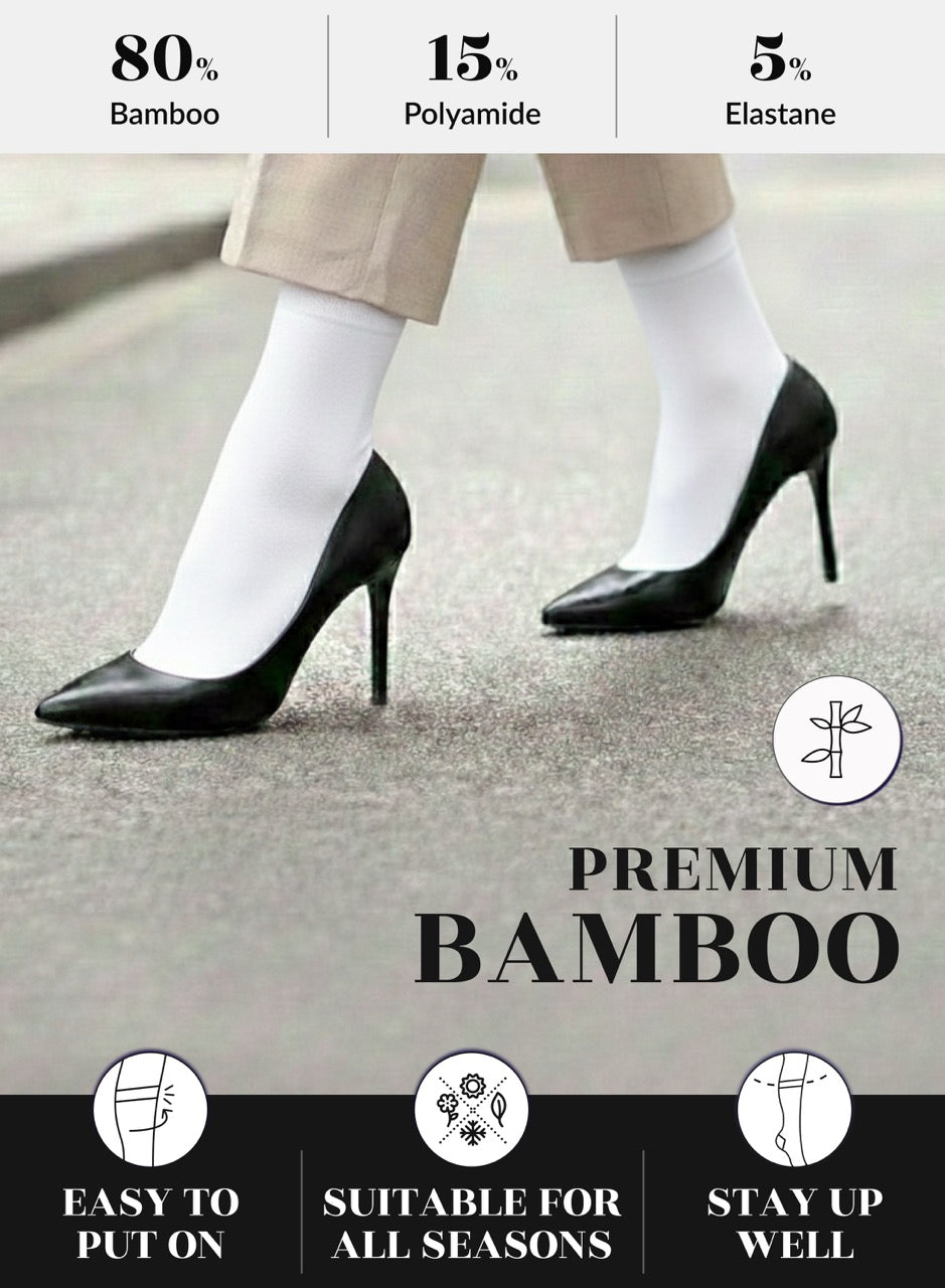 Person wearing black high heels and white socks with text on shoe composition and features.