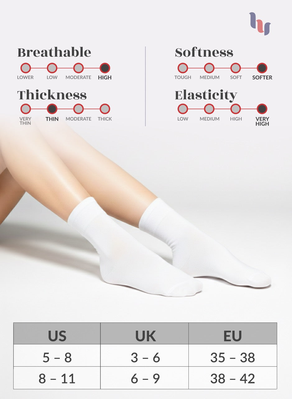 White socks with measurement chart on a light gray background