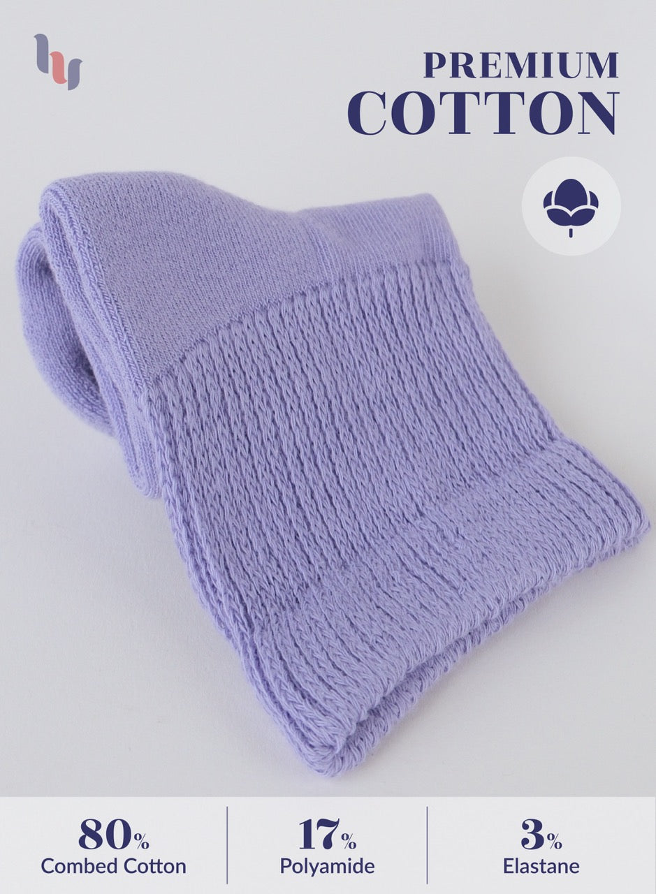 Folded Aster purple fabric with 'Premium Cotton' label and material composition details on a light gray background