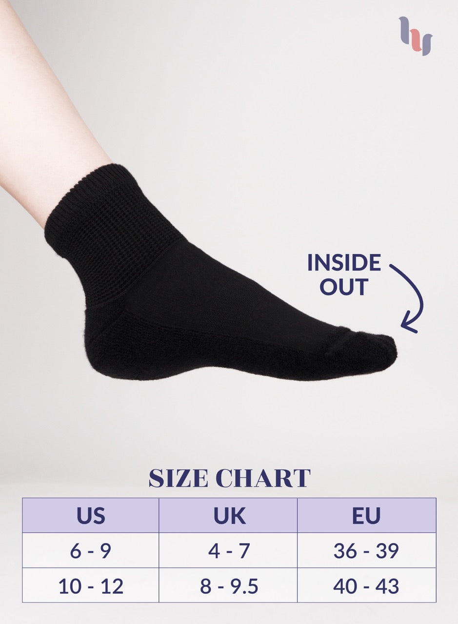 Black sock on a foot with size chart and 'Inside Out' label on a light gray background