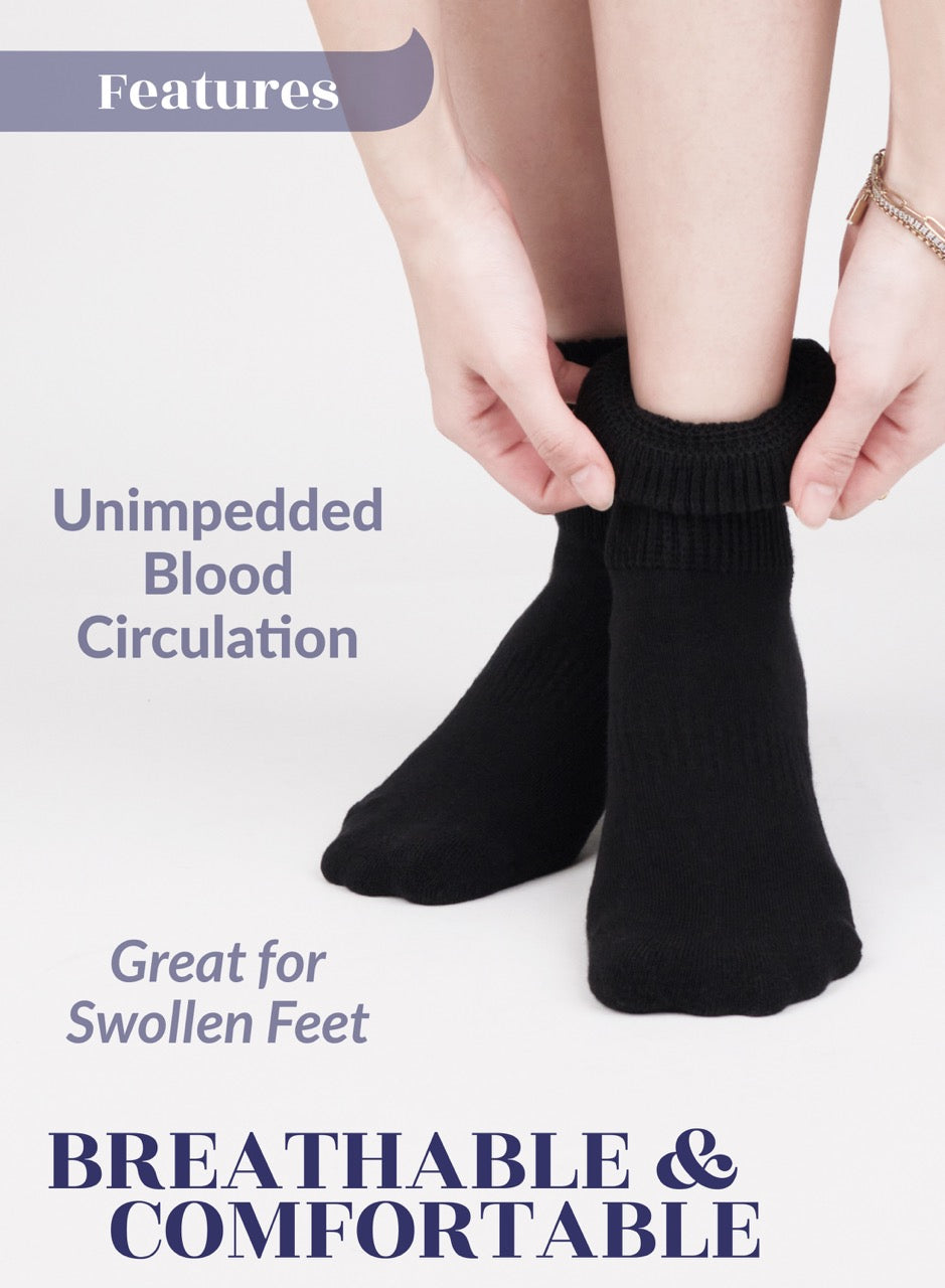 Person wearing black socks with text highlighting features on a light gray background