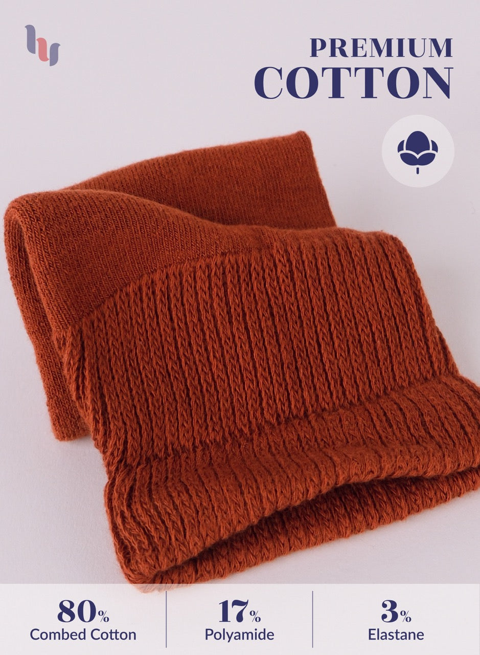 Folded bombay brown fabric with 'Premium Cotton' label and material composition details on a light gray background.